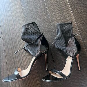 Gianvitto Rossi heels. Black fishnet booty detail
